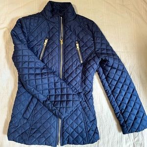Quilted navy coat with gold zippers